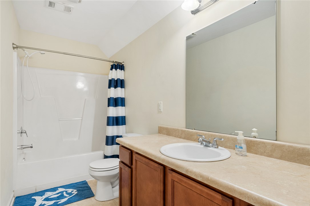 225 Streams Way Anderson, SC 29625 - Photo 37 of 50 The upstairs full bathroom features a shower-tub combination and vanity, ready for daily routines.