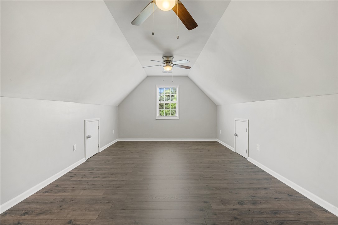 225 Streams Way Anderson, SC 29625 - Photo 38 of 50 This versatile bonus room offers tons of space with sloped ceilings, ceiling fans and durable flooring.