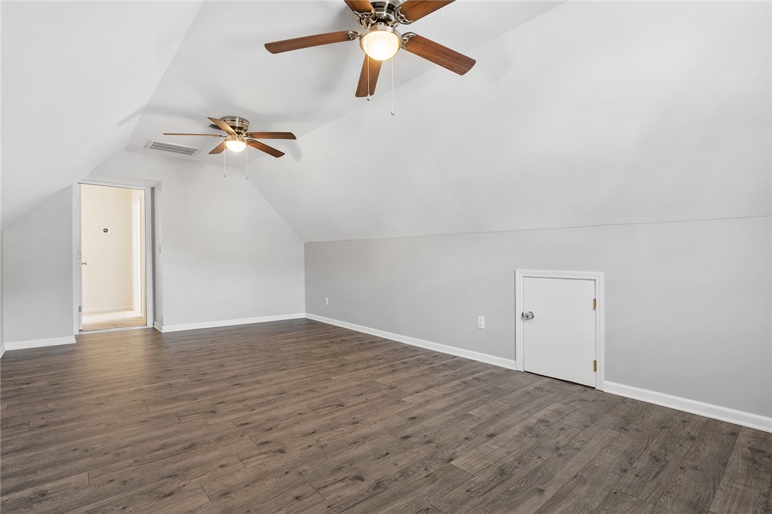 225 Streams Way Anderson, SC 29625 - Photo 39 of 50 This spacious bonus room features sloped ceilings and durable flooring, offering versatile living options.