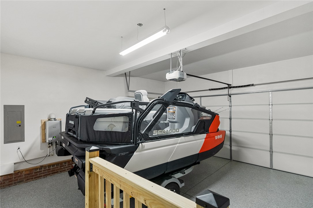 225 Streams Way Anderson, SC 29625 - Photo 41 of 50 This spacious garage features ample room for storage, new coated flooring, and easy access with a garage door.