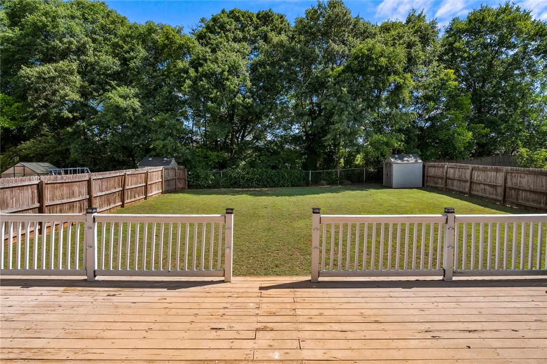 225 Streams Way Anderson, SC 29625 - Photo 45 of 50 This spacious backyard features a well-maintained lawn, perfect for outdoor activities and relaxation.