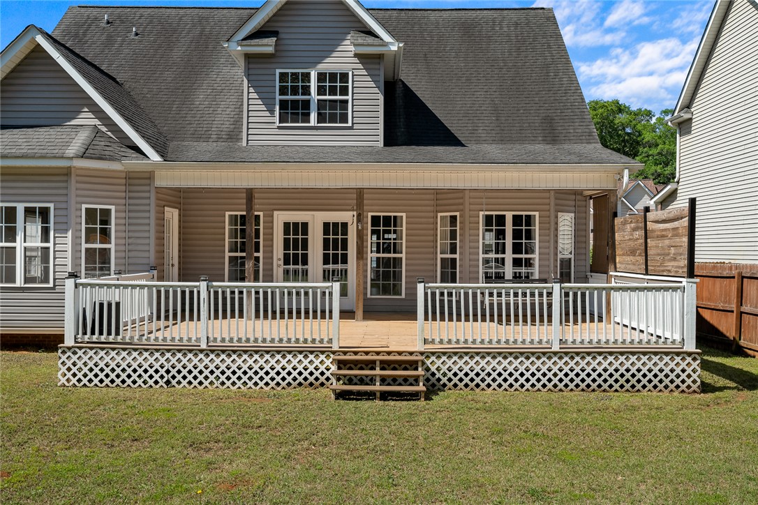 225 Streams Way Anderson, SC 29625 - Photo 47 of 50 The residence features a backyard deck and covered patio, perfect for outdoor relaxation and entertaining.
