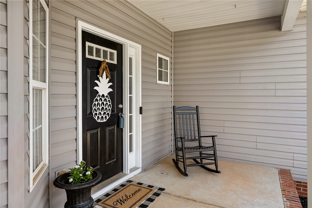 225 Streams Way Anderson, SC 29625 - Photo 6 of 50 This inviting entrance features durable siding and a welcoming porch, perfect for greeting guests or visiting with neighbors.