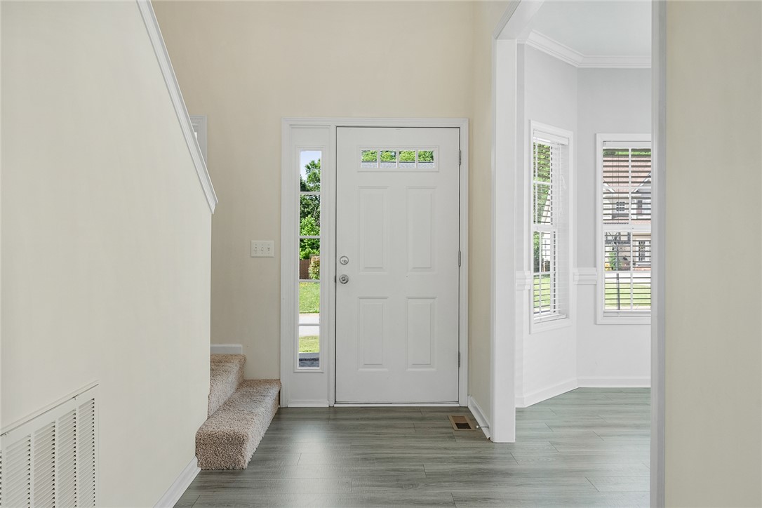 225 Streams Way Anderson, SC 29625 - Photo 8 of 50 Step into a charming entryway featuring durable LVP flooring and inviting natural light.