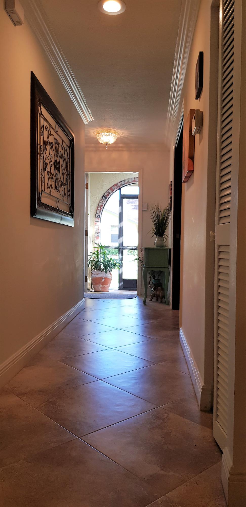 23451 Southwest 55th Avenue, Unit A Boca Raton, FL 33433 - Photo 6 of 60 Entrance In - Out