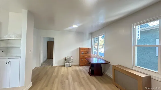 a view of kitchen with furniture and wooden floor
