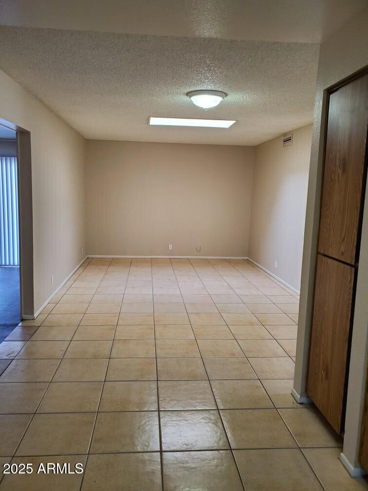 6008 West Acoma Drive Glendale, AZ 85306 - Photo 4 of 14 a view of an empty room and a window