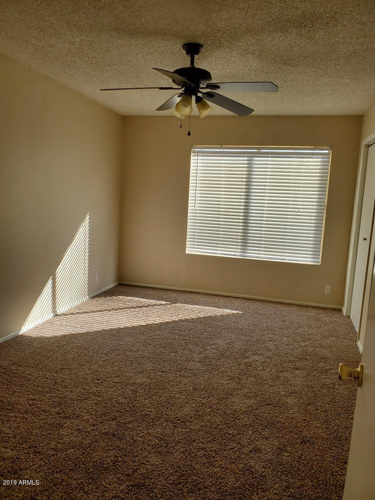 6008 West Acoma Drive Glendale, AZ 85306 - Photo 5 of 14 a view of an empty room with a window