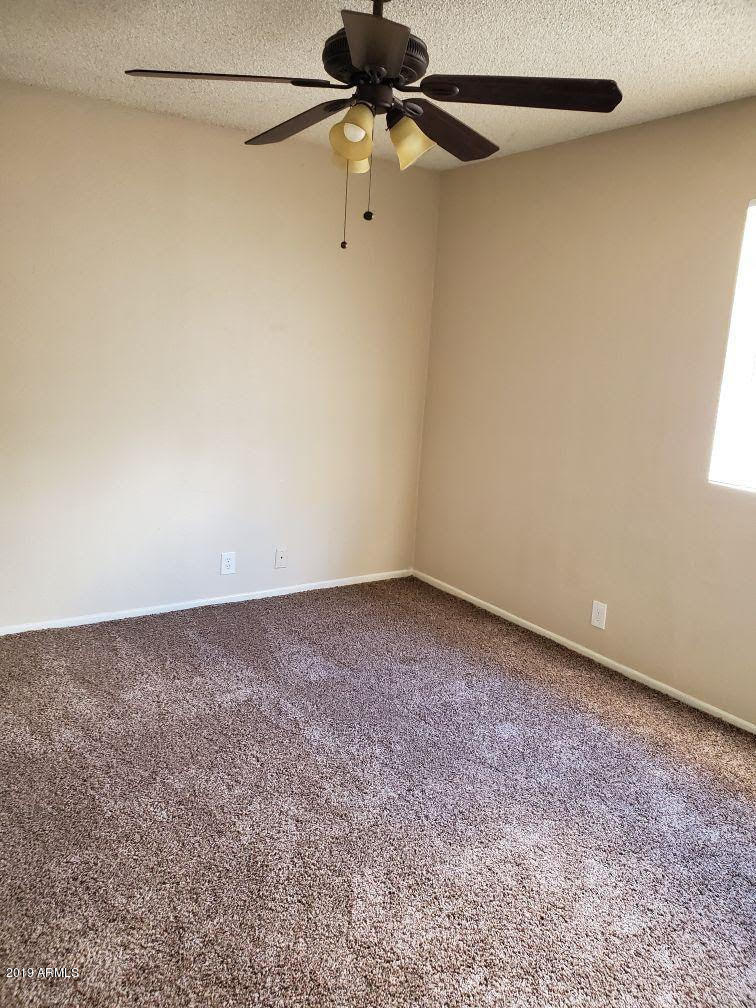 6008 West Acoma Drive Glendale, AZ 85306 - Photo 6 of 14 a view of a window in an empty room