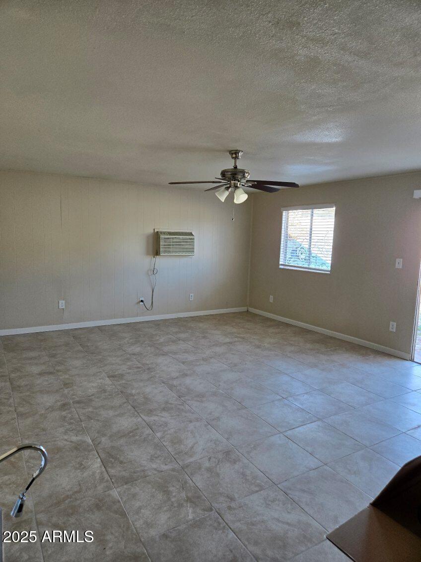 6008 West Acoma Drive Glendale, AZ 85306 - Photo 7 of 14 an empty room with a empty space and windows
