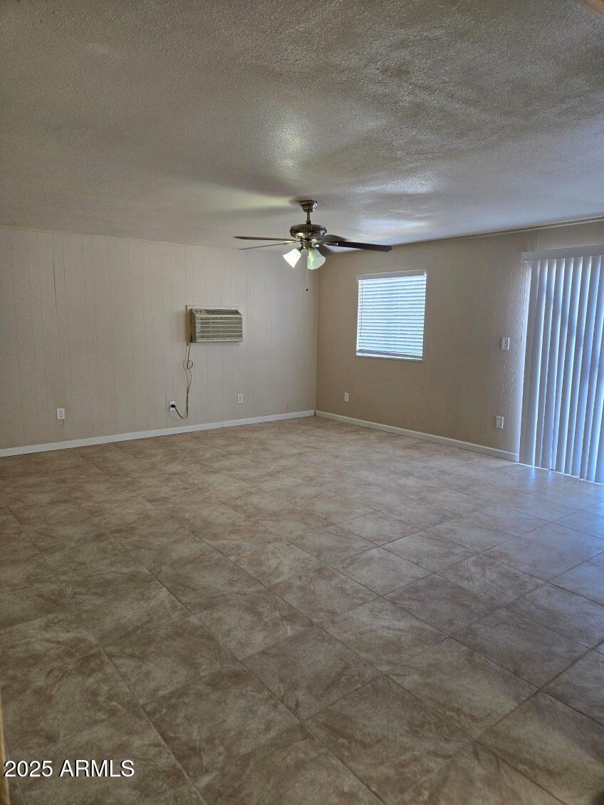 6008 West Acoma Drive Glendale, AZ 85306 - Photo 8 of 14 an empty room with windows and fan