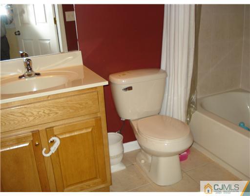 9 Lafayette Street Carteret, NJ 07008 - Photo 11 of 18 a bathroom with a toilet and a sink