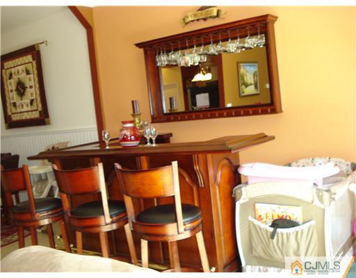 9 Lafayette Street Carteret, NJ 07008 - Photo 16 of 18 a living room with a table and chairs