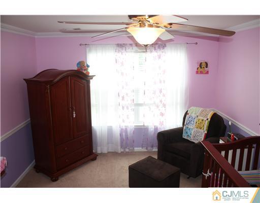 9 Lafayette Street Carteret, NJ 07008 - Photo 7 of 18 a view of a livingroom with furniture and a window