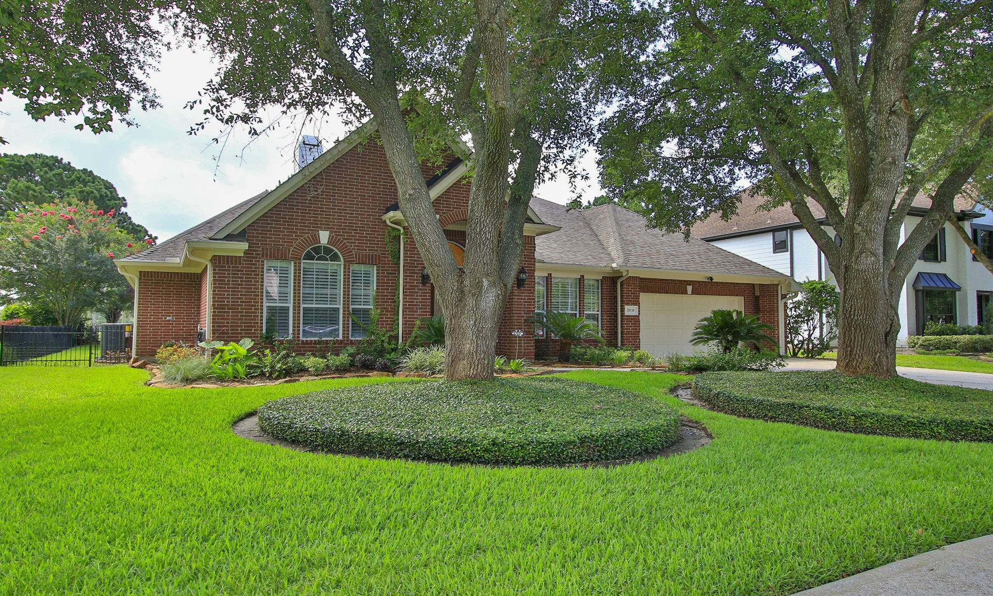 20110 Stormy Pine Lane Spring, TX 77379 - Photo 2 of 44 An impressive front elevation adorned with a beautiful landscape, stunning mature trees and extra-wide driveway.