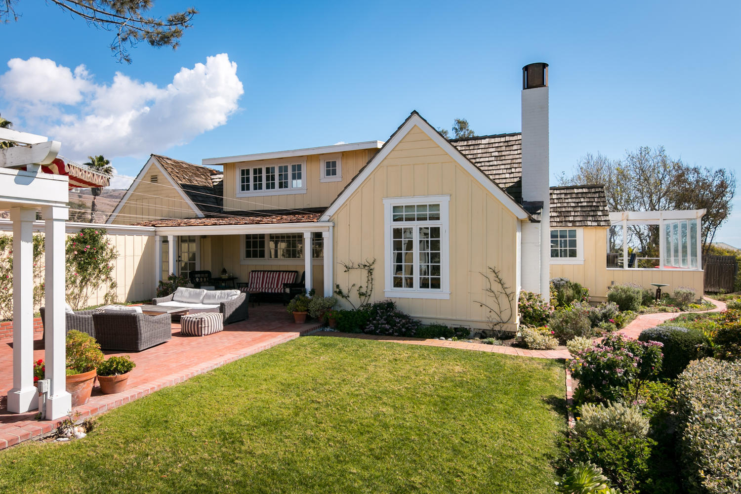 181 Rincon Point Road Carpinteria, CA 93013 - Photo 1 of 44 a front view of house with yard and trees around