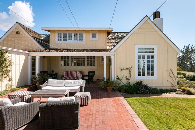 a view of house with patio outdoor seating