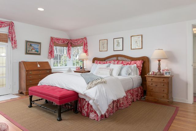 a bedroom with a bed and a table in it