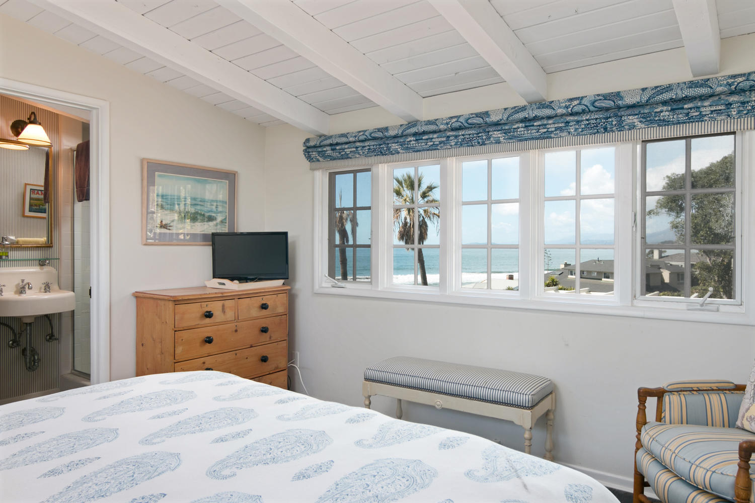 181 Rincon Point Road Carpinteria, CA 93013 - Photo 29 of 44 a bedroom with a bed and a dresser next to a window