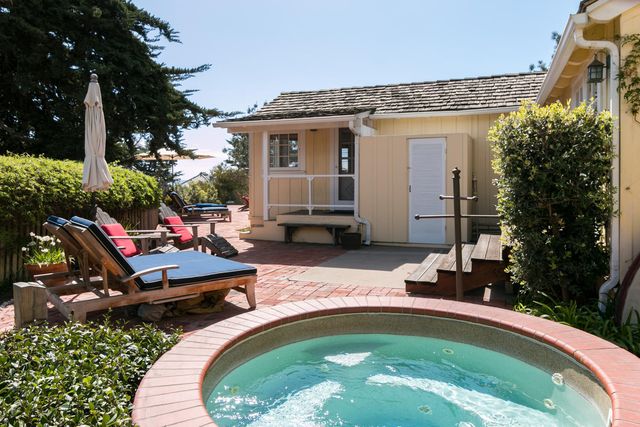 a swimming pool with outdoor seating