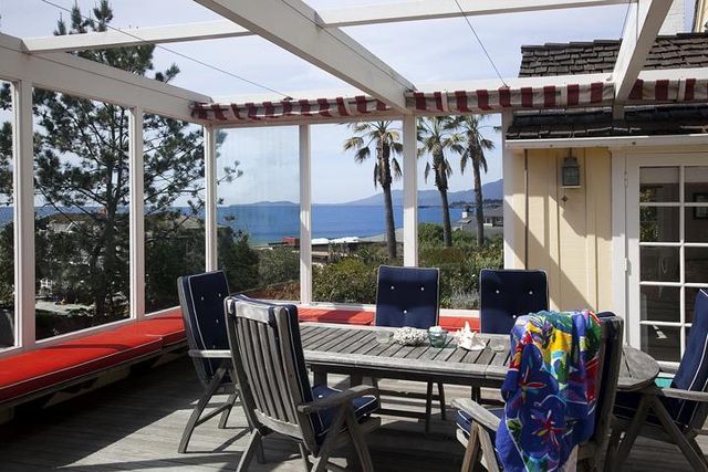 a view of a chairs and table in a patio