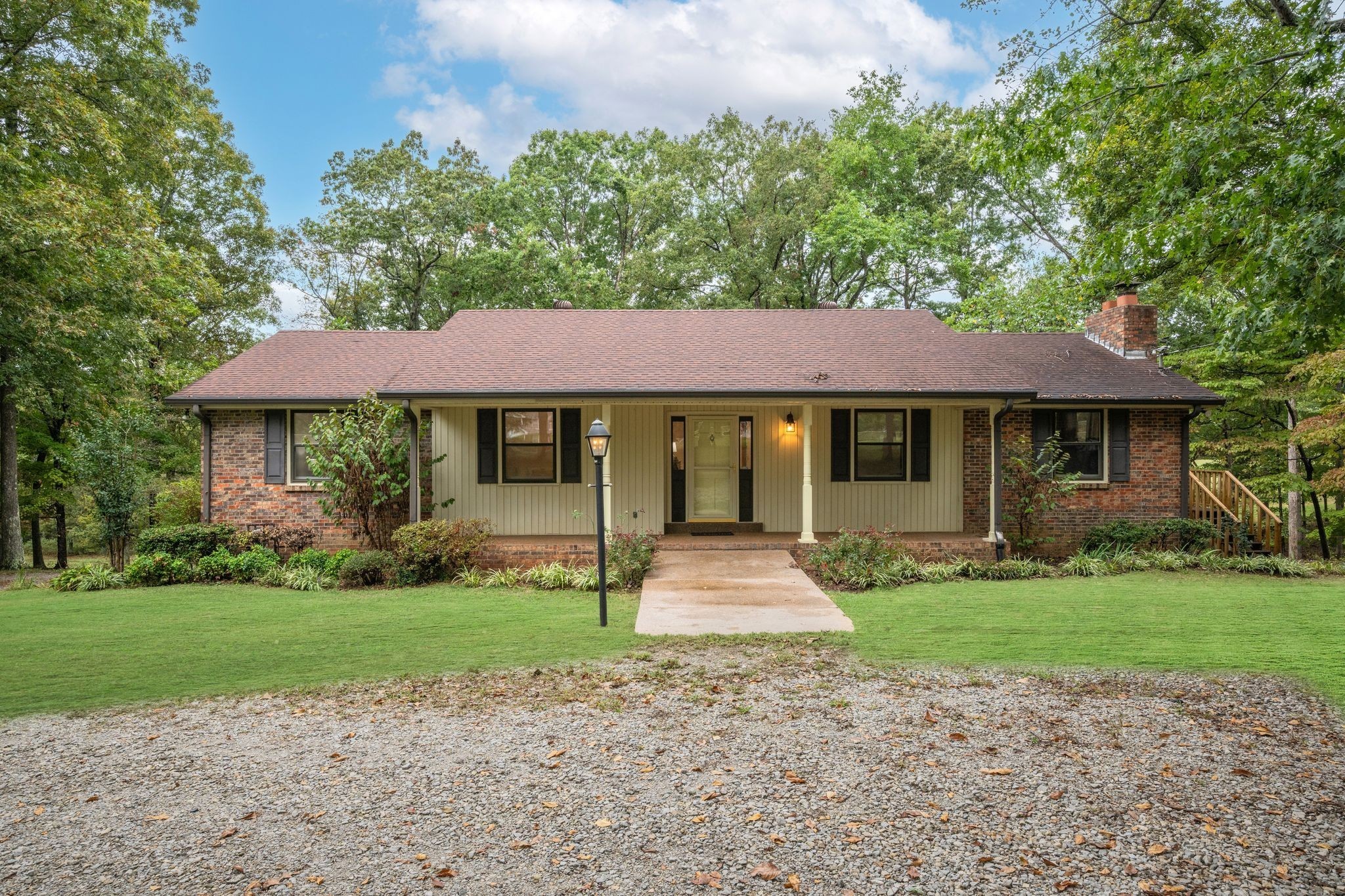 1085 Claylick Road White Bluff, TN 37187 - Photo 2 of 48 a front view of a house with a garden and porch