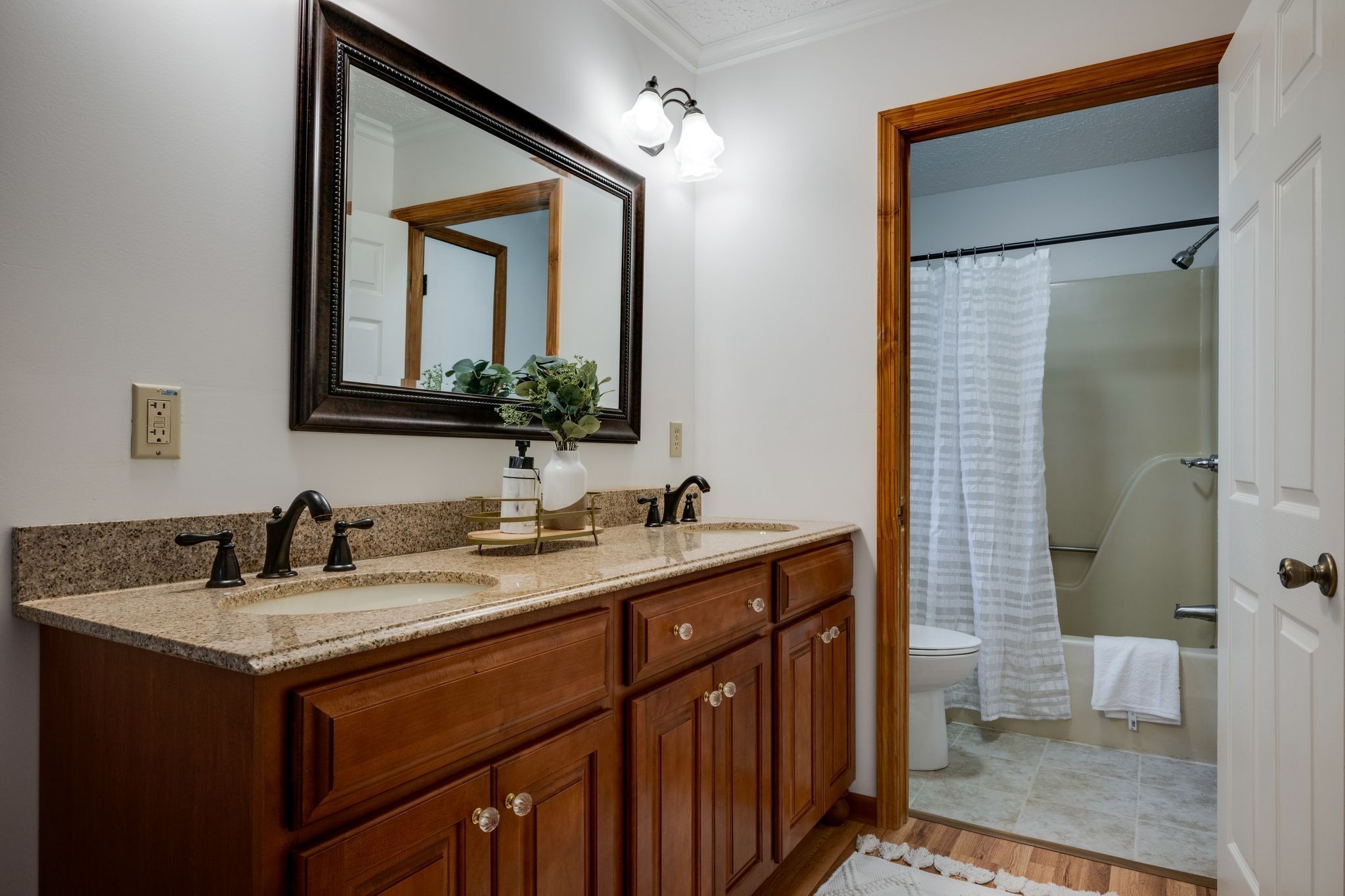 1085 Claylick Road White Bluff, TN 37187 - Photo 25 of 48 a bathroom with a granite countertop sink a toilet and a mirror
