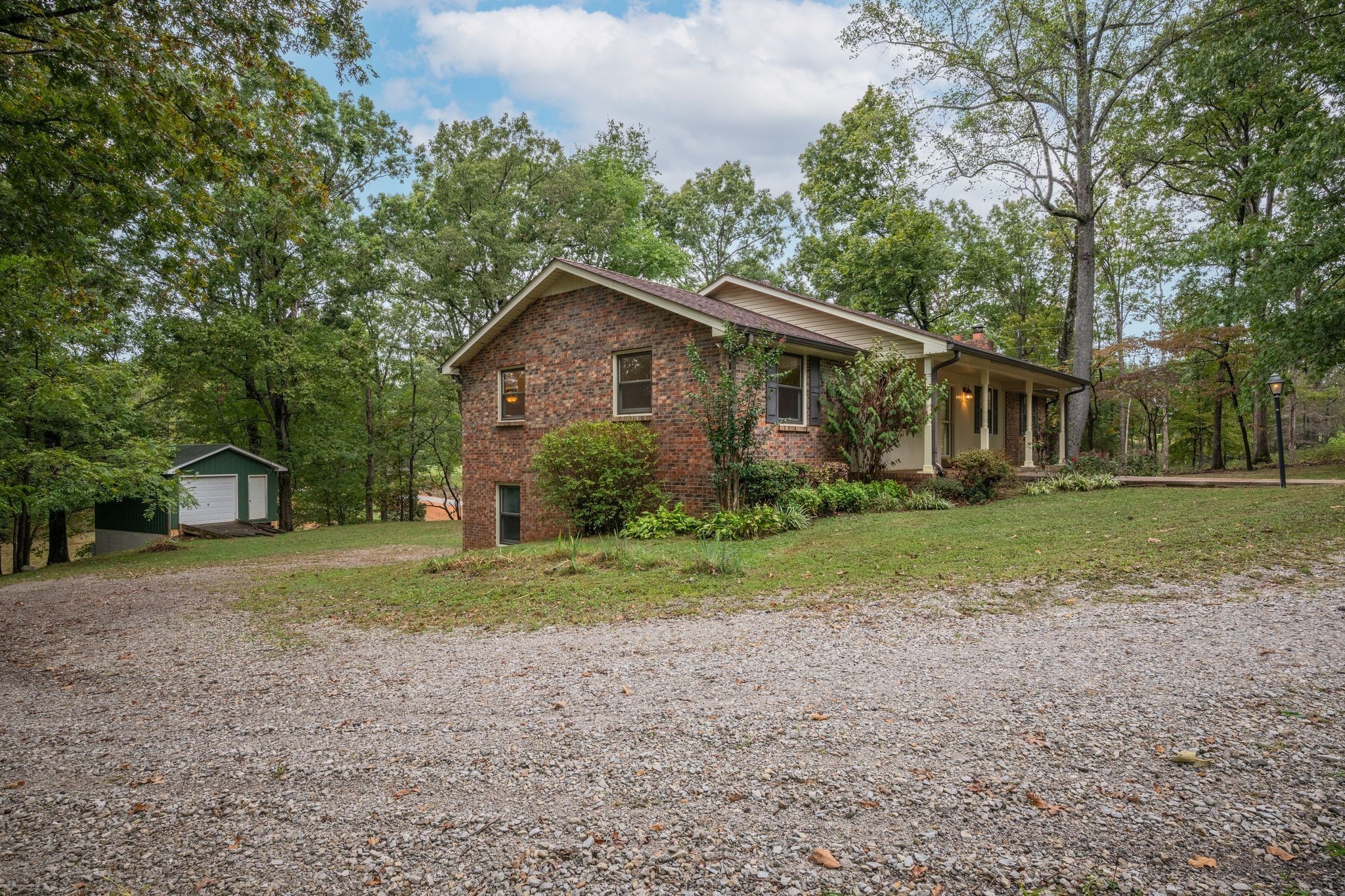 1085 Claylick Road White Bluff, TN 37187 - Photo 42 of 48 a view of a house with a yard and large trees