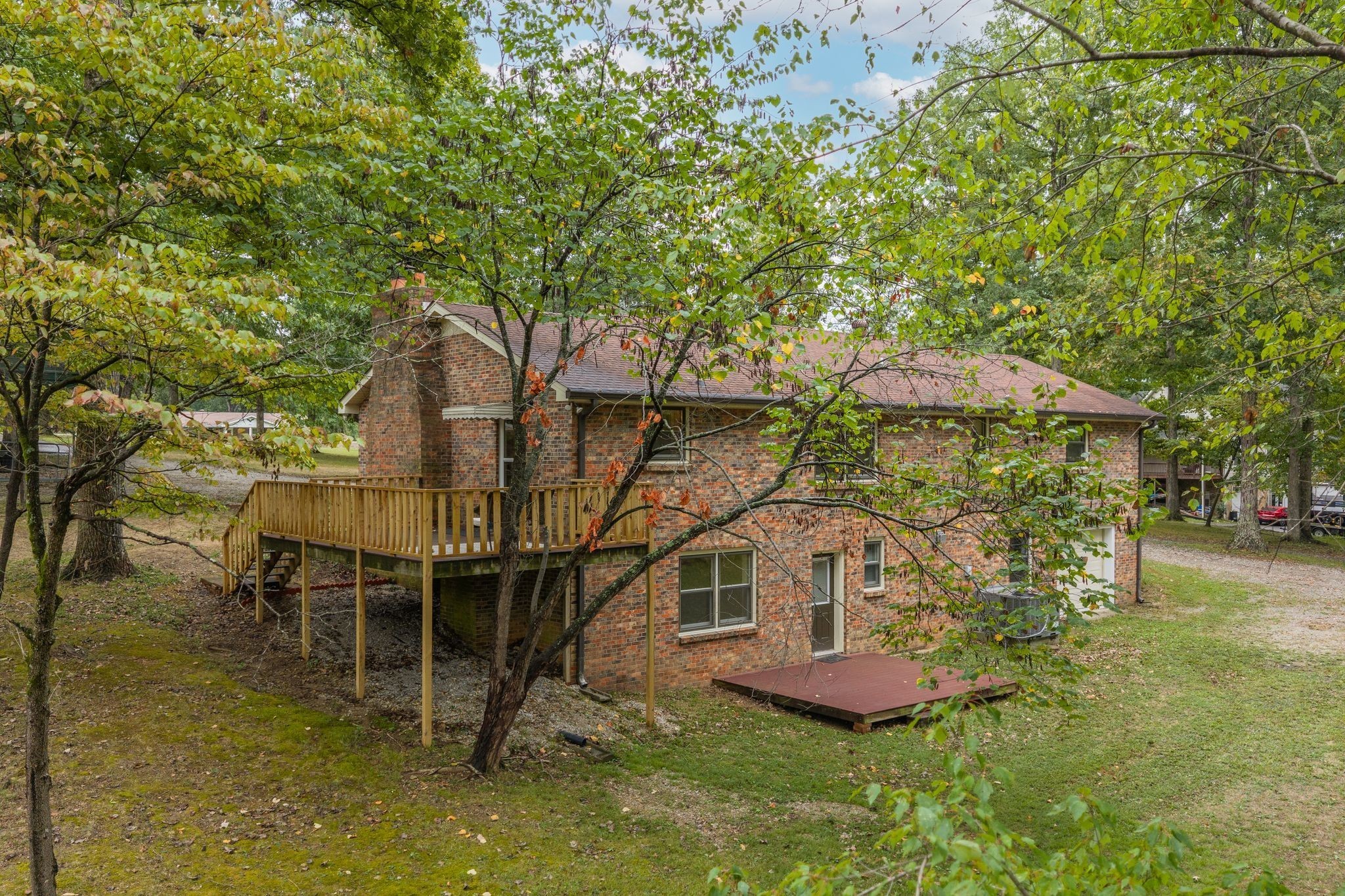 1085 Claylick Road White Bluff, TN 37187 - Photo 45 of 48 a table and chairs sitting in the patio next to a yard