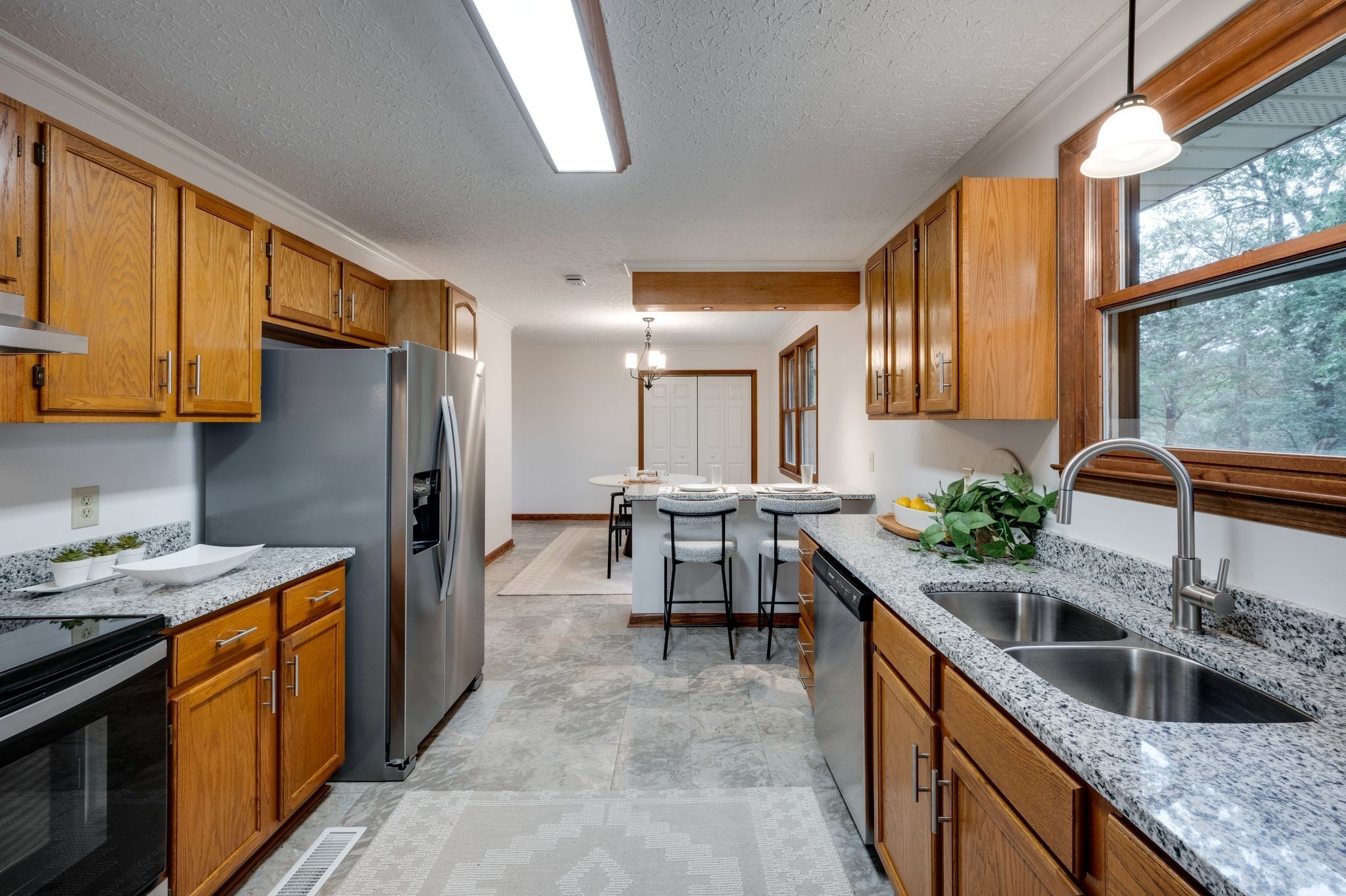 1085 Claylick Road White Bluff, TN 37187 - Photo 10 of 48 a kitchen with stainless steel appliances granite countertop sink stove refrigerator and cabinets