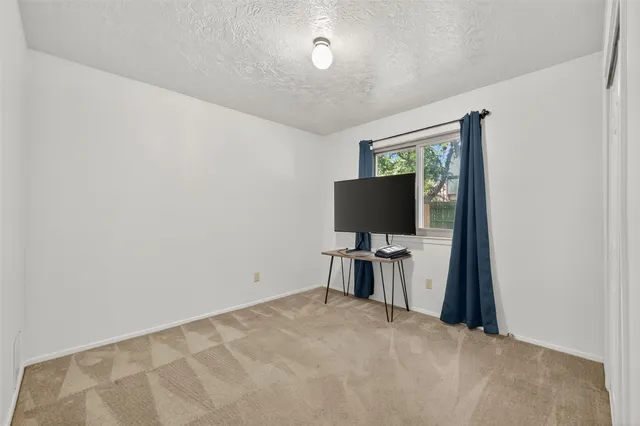 a view of a livingroom with a flat screen tv