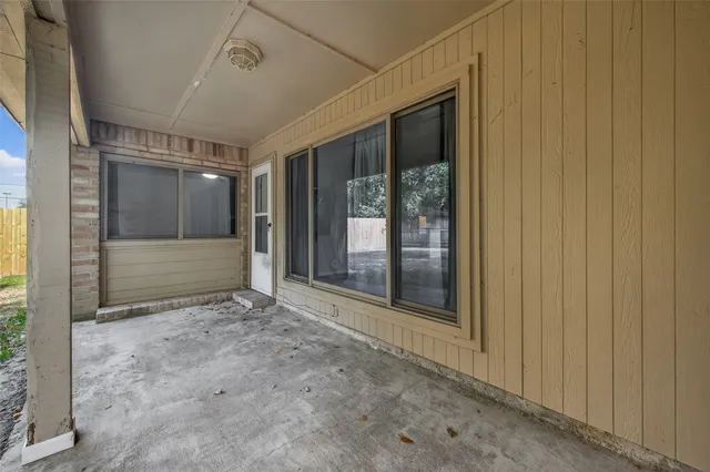 a view of room with window and front door