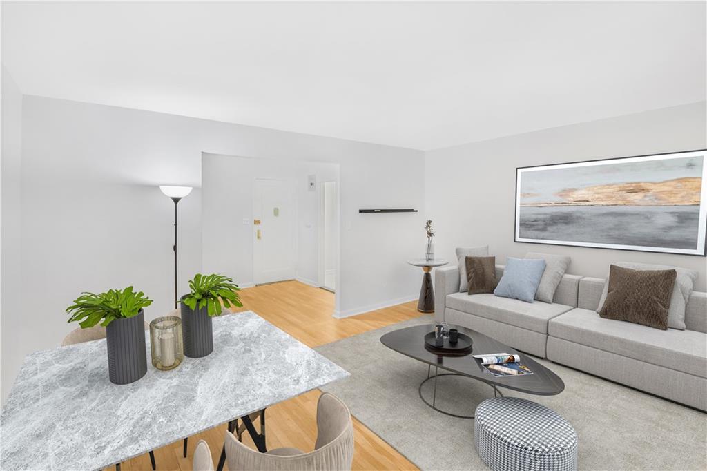 a living room with furniture potted plant and a potted plant