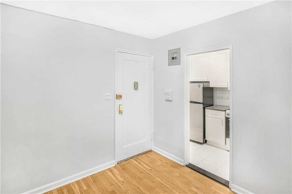 7259 Shore Road, Unit 3A Brooklyn, NY 11209 - Photo 5 of 11 a view of empty room with wooden floor