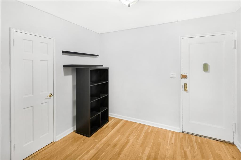 7259 Shore Road, Unit 3A Brooklyn, NY 11209 - Photo 6 of 11 a view of empty room with wooden floor