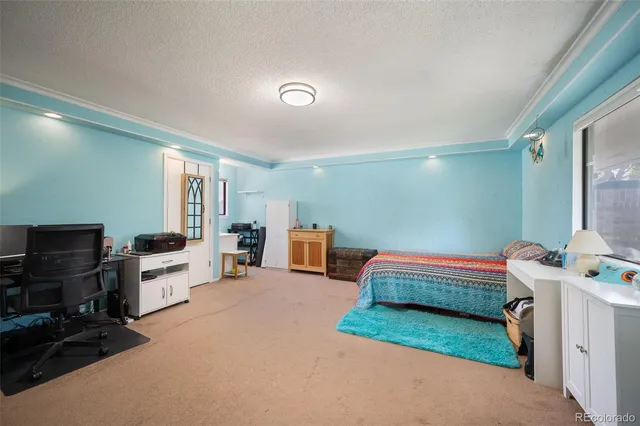 a room with furniture and a flat screen tv