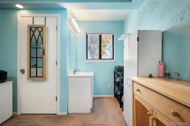 a utility room with a sink a washer and dryer
