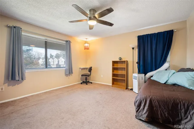 a bedroom with furniture and window
