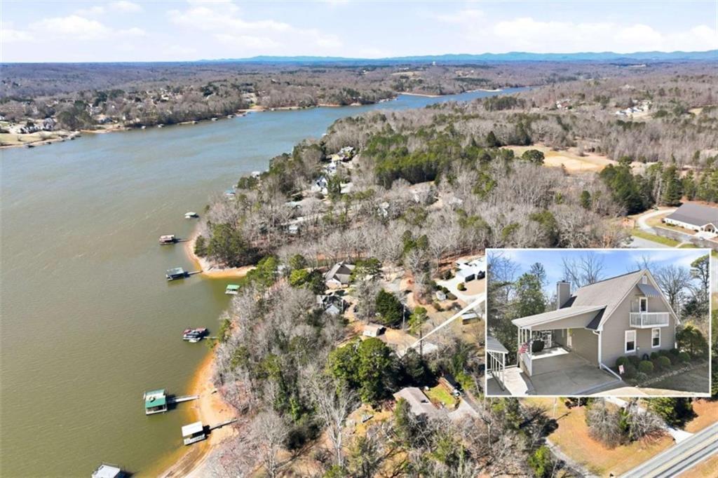 an aerial view of a house with a lake view