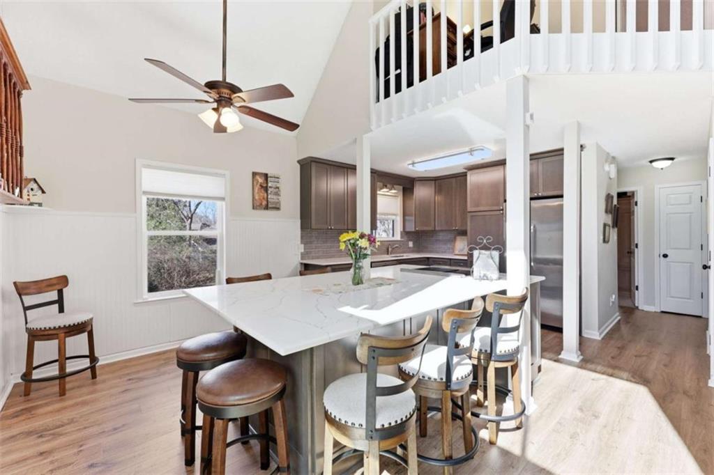 4033 Mt Vernon Road Gainesville, GA 30506 - Photo 12 of 47 a view of a dining room with furniture and wooden floor