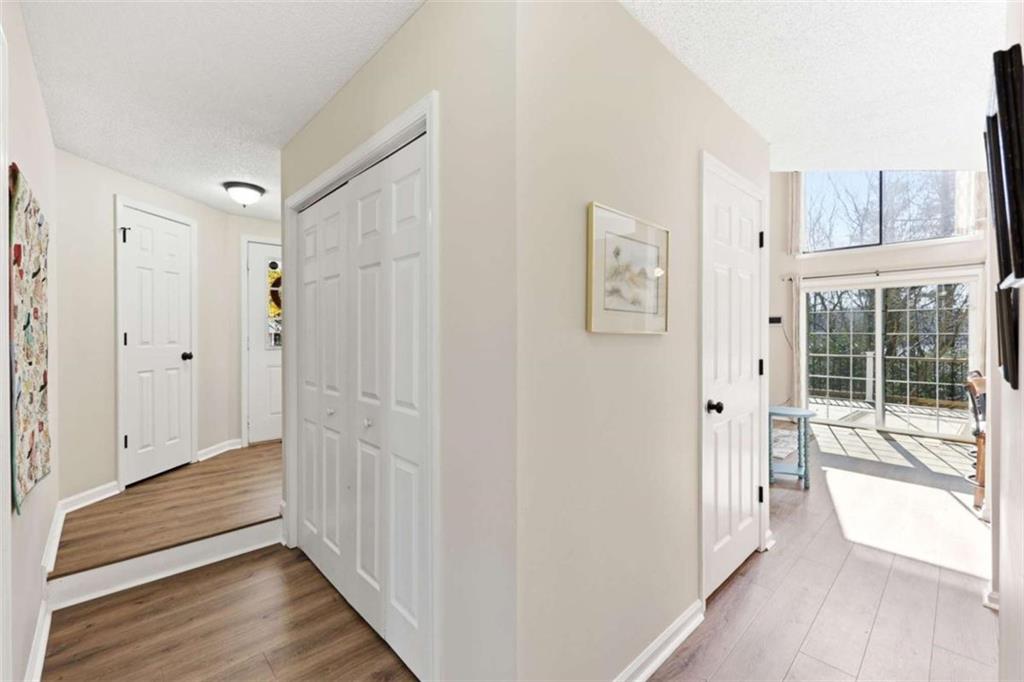4033 Mt Vernon Road Gainesville, GA 30506 - Photo 16 of 47 a view of a hallway with wooden floor and a cabinet