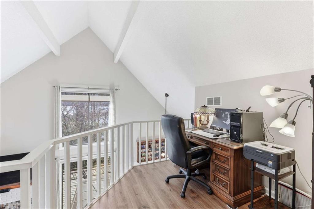 4033 Mt Vernon Road Gainesville, GA 30506 - Photo 22 of 47 a view of a workspace with furniture and a window