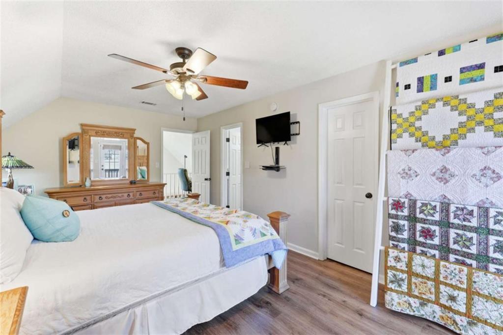 4033 Mt Vernon Road Gainesville, GA 30506 - Photo 25 of 47 a bedroom with a bed and wooden floor