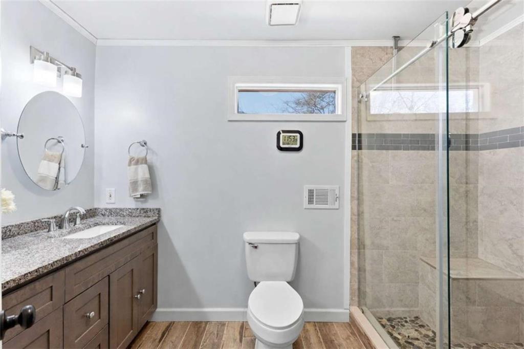 4033 Mt Vernon Road Gainesville, GA 30506 - Photo 26 of 47 a bathroom with a granite countertop sink toilet and a mirror
