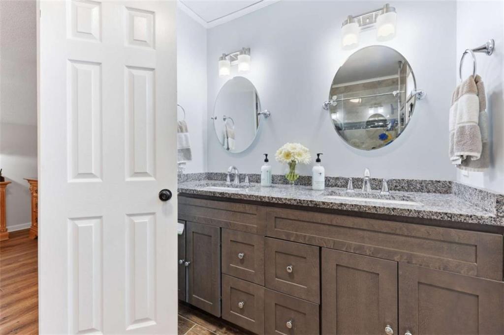 4033 Mt Vernon Road Gainesville, GA 30506 - Photo 27 of 47 a bathroom with a granite countertop double vanity mirror and a mirror