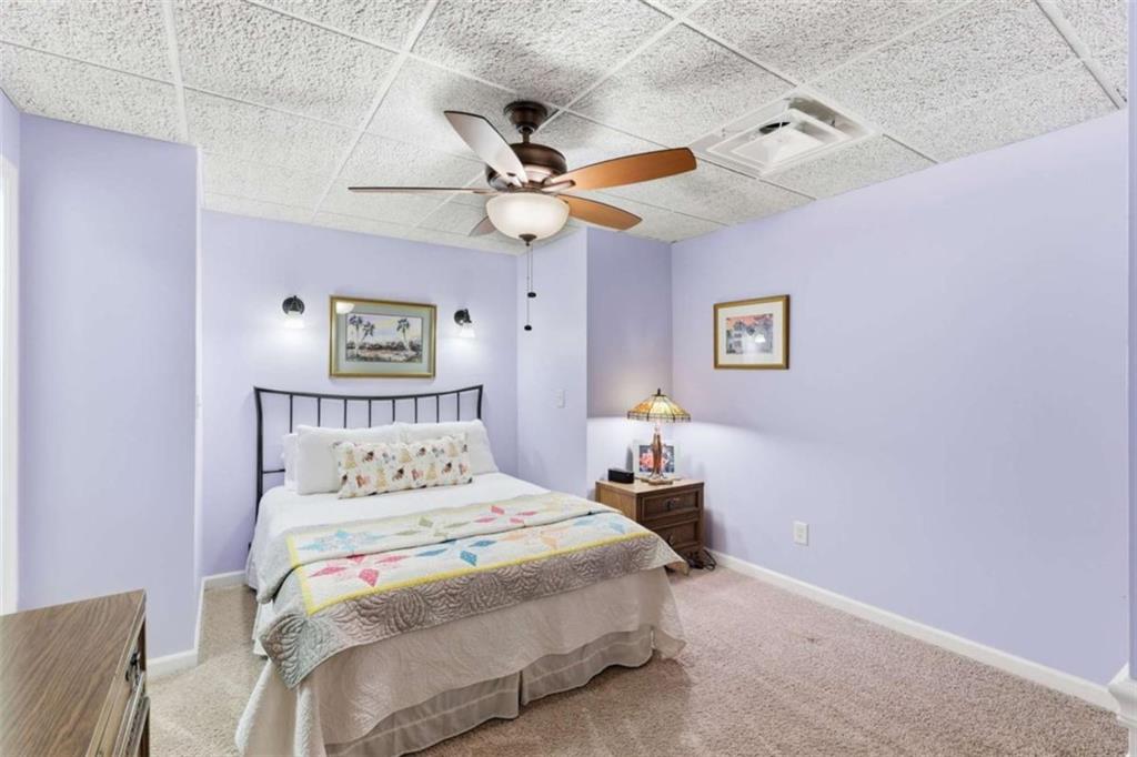 4033 Mt Vernon Road Gainesville, GA 30506 - Photo 33 of 47 a bedroom with a bed and a chandelier