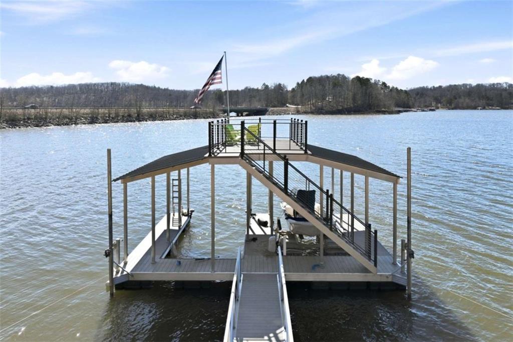 4033 Mt Vernon Road Gainesville, GA 30506 - Photo 44 of 47 a view of a balcony with wooden floor and lake view