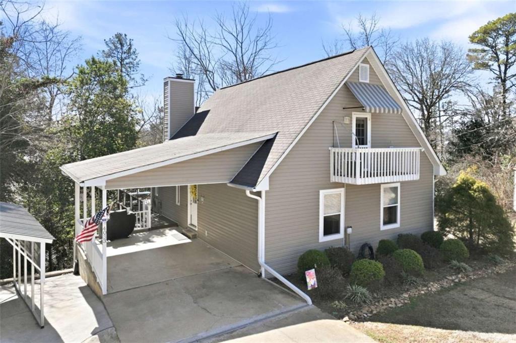 4033 Mt Vernon Road Gainesville, GA 30506 - Photo 7 of 47 a view of a white house next to a yard