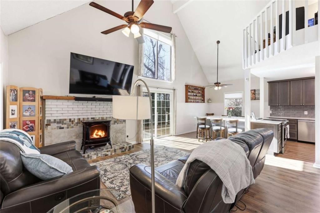 4033 Mt Vernon Road Gainesville, GA 30506 - Photo 9 of 47 a living room with fireplace furniture and a flat screen tv