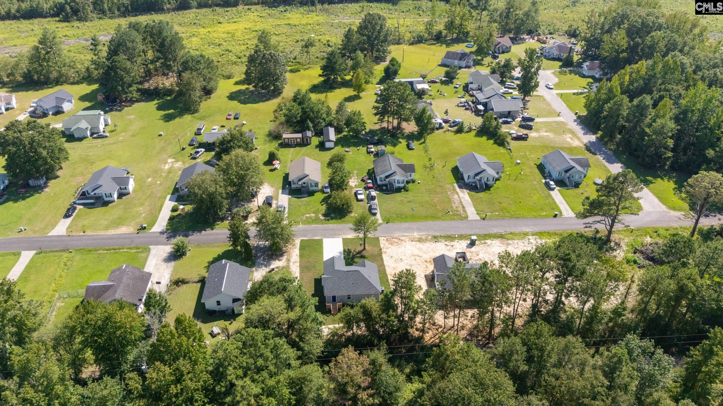 116 Sunny Acres Road Eastover, SC 29044 - Photo 37 of 40 an aerial view of residential houses with outdoor space and trees all around